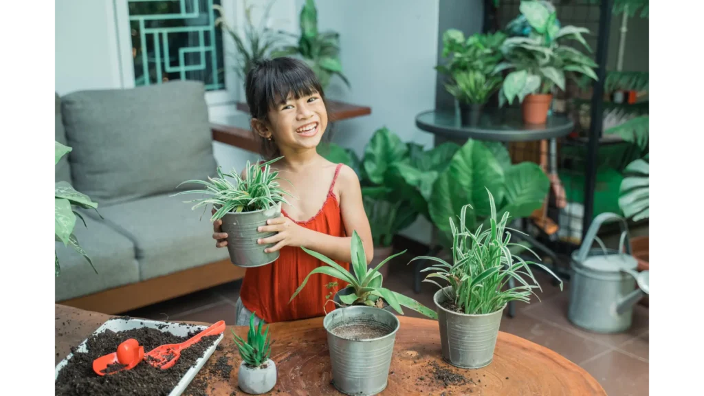 Image of a small girl holding a flower pot